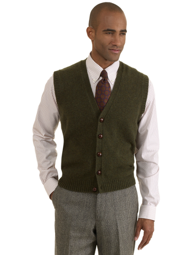 Pure Scottish Shetland wool. Button-front body with genuine leather buttons. Fully fashioned. Dry clean. Imported.