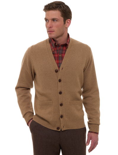 Luxuriously soft baby camel hair in a natural color. Classic button-front cardigan with genuine woven leather buttons. Fully fashioned. Imported.