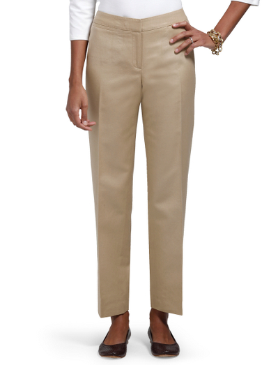Cotton/linen. Plain front with contoured waistband. Center front zipper. Front and back besom pockets. Inside hidden button and hook and bar closure at waist. 29 1/2" inseam. Dry clean. Fabric woven in Italy. Imported.