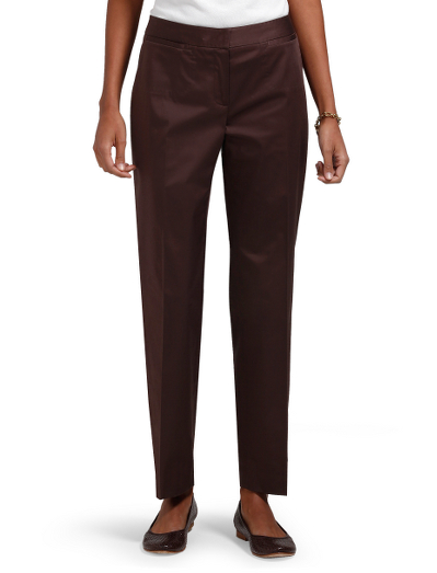 Cotton/Lycra. Plain front with contoured waistband. Center front zipper. Back besom pockets. Inside hidden waistband tab with button closure. 29 1/2" inseam. Dry clean. Imported.