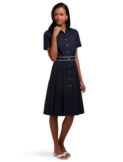 Cotton/silk. Mother-of-pearl buttons. Pleated from waist down. Button-front closure. White piping detail at waistband. 39" length. Dry clean. Imported.
