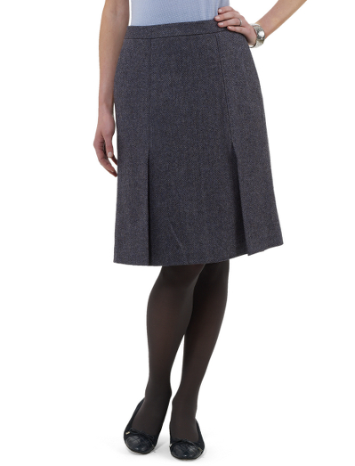 Double inverted pleats add shape and movement to wool herringbone woven in the United Kingdom by Robert Noble.  Front slant pockets. Invisible side zipper. 24" center back length. Dry clean. Imported,