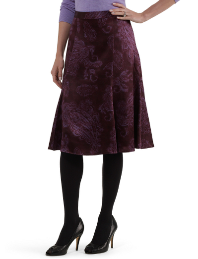 Silk charmeuse. Front and back princess seams.  A slighty fuller skirt. Hidden side zip with covered button closure at waistband.  Fully lined in Bemberg,  24" length.  Dry clean.  Imported.