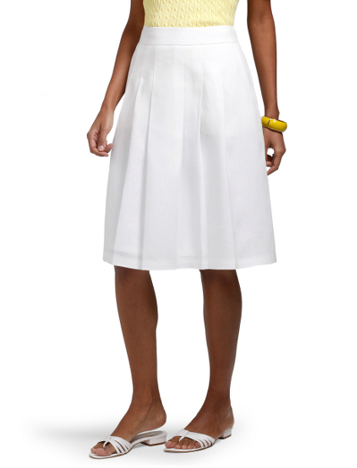 Irish linen. Partially stitched down pleats at front and back. Side zip. Contoured waistband. Front slant pockets. Fully lined in Bemberg. 22 1/2" length. Dry clean. Imported. Also available in Misses.