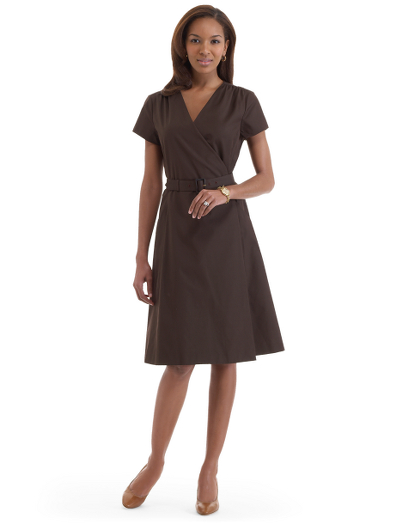 Cotton/silk. Mother-of-pearl buttons. Button waist closure at inside and outer wrap. Front-slant pockets. Shirring detail at shoulders. Self covered belt at waist with faux horn buckle. Dry clean. Imported. Also available in Misses.