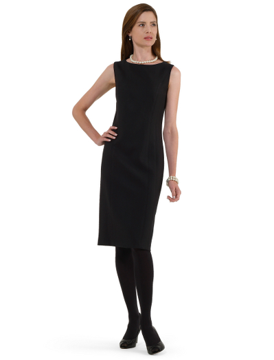 Wool/Lycra woven in Italy. Plain front with princess seam panels. Fully lined in Bemberg. Back zip. 36 1/2" center back length. Dry clean. Imported.