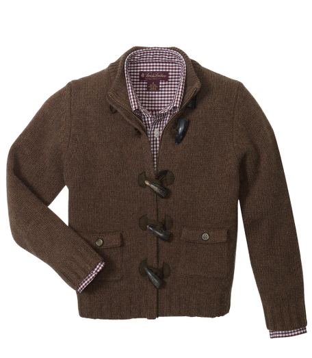 Lambswool cardigan. Ribbed neck. Fully fashioned. Toggle closure. Suede trim. Dry clean. Imported.