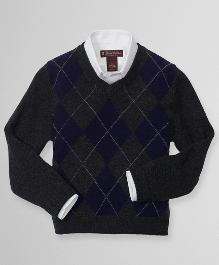 Scottish cashmere. V-neck. Long sleeve with ribbed neck. Fully fashioned. Dry clean. Imported.