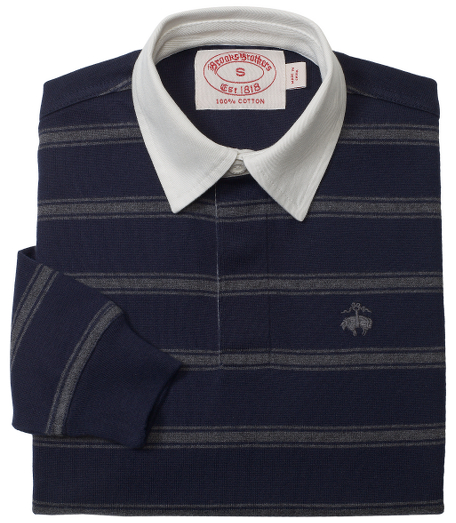 Classic rugby style in pure cotton. Contrasting rugby collar and placket. Detailed with rubber buttons and embroidered chest logo. Machine wash. Imported.