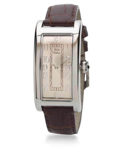 Feminine and elegant, this watch is shaped to mirror the contour of a lady's wrist. Champagne dial with applied numbers. Swiss made. Quartz movement. Stainless steel case with anti-reflection mineral glass. A semi-precious blue agate stone adorns the crown. Case measures 1.85" x .91". Crocodile-embossed leather band. Imported.
