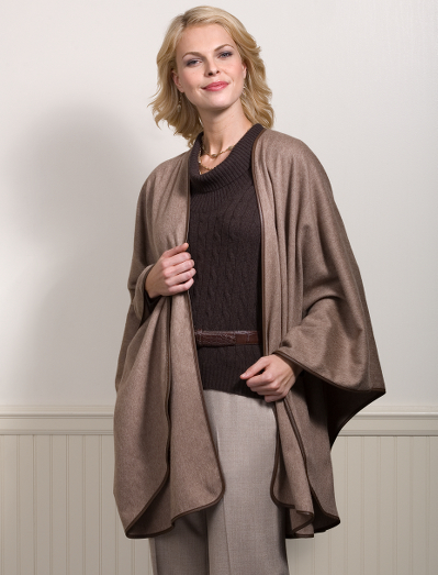 70% cashmere. 30% mink. Mink/cashmere spun yarn. Light brown melange color with brown nappa leather trim. 55" x 67". Dry clean. Made in Italy exclusively for Brooks Brothers by Colombo.
