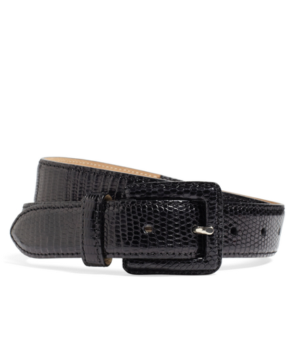Genuine lizard. Sterling silver hardware. Leather lined. Made in Italy.