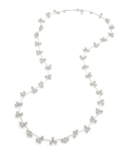 Delicate black resin bead clusters hang off 36" long necklace. Silver-plated base metal. Imported. Presented in a beautiful gift box.