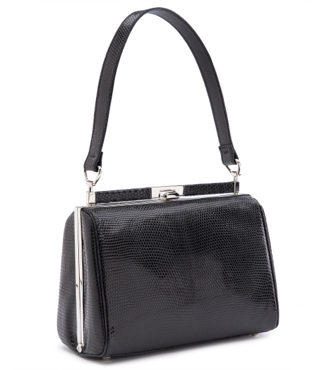 Genuine lizard lined with suede. Interior pockets. Snap closure. 8" x 6" x 3". 7" handle drop. Made in Italy.