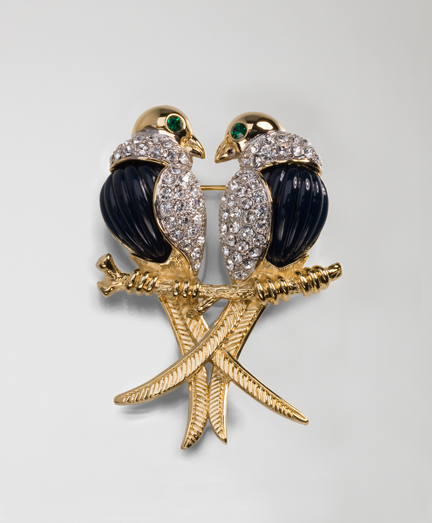 14k Gold plated Sterling silver and Austrian crystal. Part of the Brooks Brothers-Audubon Society Collaboration Collection. Design inspired from Audubon's "Birds of America" collection. Pave crystal pin fashioned after the Kingbird. Presented in a beautiful gift box. Imported