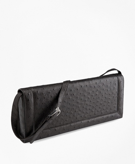 Ostrich leather. Lined with suede. Shoulder strap. 13 1/4" x 5 1/2" x 2". Made in Italy. Presented in a gift box.