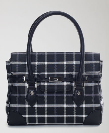 Signature tattersall in polyester with genuine calfskin handles. Lined in moire. Magnetic closure. Golden Fleece logo stud detailing. Detailed with silver-tone hardware.  Zippered interior pocket. 11" x 9" x 3". 6" handle drop. Imported.