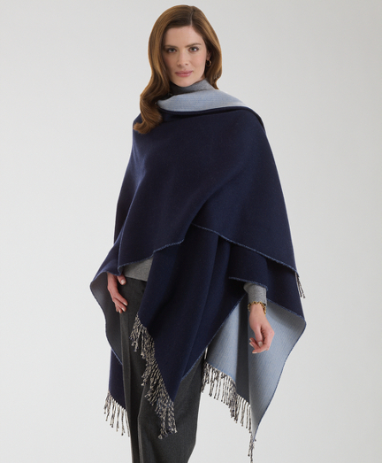 Pure merino wool. Solid reversing to herringbone pattern. 55" x 28" plus 4" fringe. Professional clean. Imported.