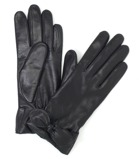 Genuine soft sheepskin leather with a feminine bow detail at wrist. Cashmere lined. 3-button length. Professionally clean. Imported.