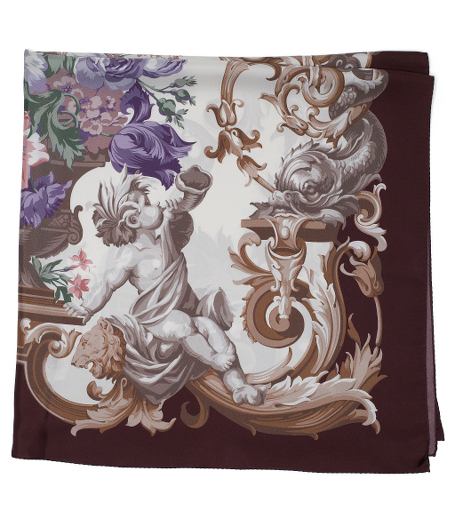 Pure silk twill. Dramatic floral design with contrasting border. 36" x 36". Presented in a gift box. Dry clean. Made in Italy.