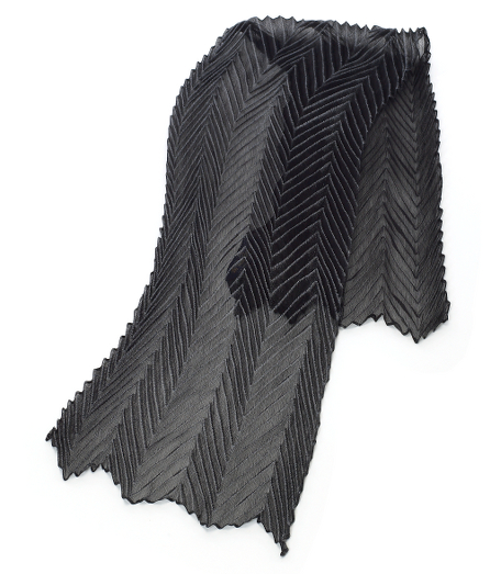 Pure silk crepe. Sheer pleated scarf. Pleats are accented with contrasting color. 16" x 56". Dry clean. Made in Italy.