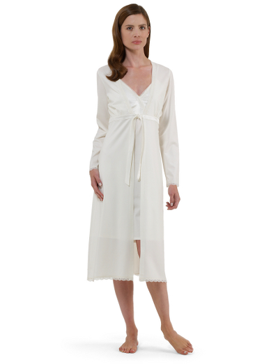 Silky double mercerized stretch cotton. Satin and lace details at neck, hem, and sleeve. Empire tie waist.  Falls below the knee. Machine wash. Imported.
