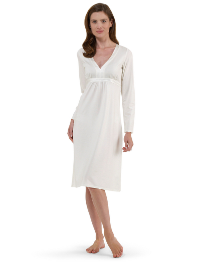 Silky double mercerized stretch cotton. Satin details. V-neck, empire waist. 3/4 sleeve. Falls below the knee. Machine wash. Imported.