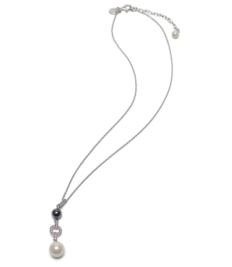 Beautiful linear drop pendant with two glass pearls, one white and one black. Pearls are separated with pave crystal station on an adjustable 17" sterling silver chain. Presented in a gift box. Imported.