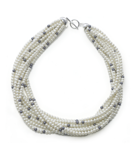 Nine row toursade necklace of 4mm white glass pearls interspersed with black 4mm pearls. 18" length. Can be worn straight or twisted for a more elegant look. Presented in a beautiful gift box. Imported.