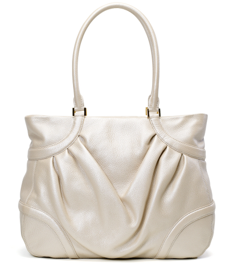Leather. Gold hardware. Lined in beige moire. Interior zippered pocket, cell phone pocket and open pocket. Zipper closure. 16" x 12 1/2" x 5". 9 1/2" from top of bag to top of handle. Imported.
