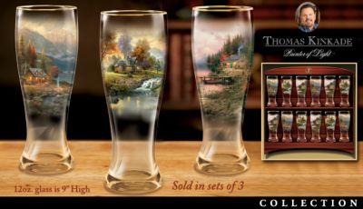 Click here to buy Thomas Kinkade Mountain Hideaways Pilsner Glass Collection by The Bradford Exchange.