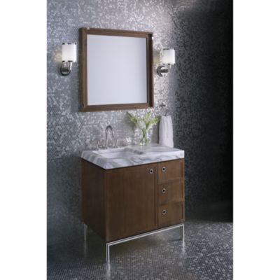 Shown is the Vir Stil 1.0 Vanity in White Lacquer; Pre-cut Top in Calacatta Borghini; Basin Set, Trim and Vanity Legs in Bronze
