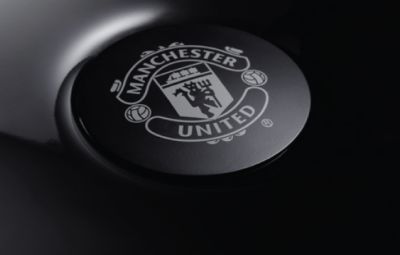 Grey Manchester United logo with matt black finishing