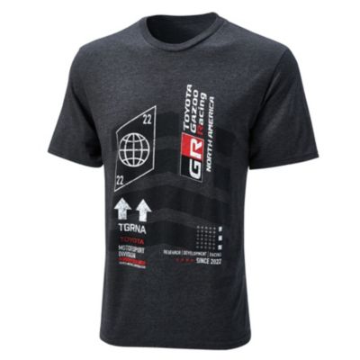 A black T-shirt with white and red graphic designs, including a globe inside a hexagon, arrows, and various texts like ""TOYOTA GAZOO RACING"" and ""GR.""