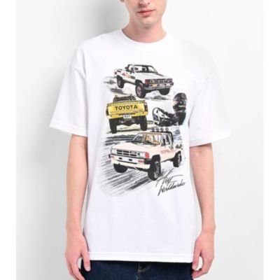 A white T-shirt with illustrations of Toyota vehicles and the Toyota logo.
