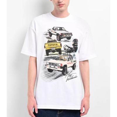 A white T-shirt with illustrations of Toyota vehicles and the Toyota logo.