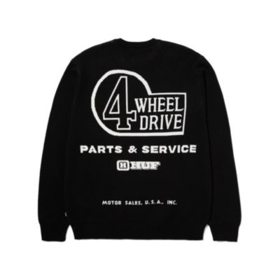 Back of a black sweatshirt featuring white text and graphics that read '4 Wheel Drive Parts & Service – HUF Motor Sales, U.S.A., Inc.