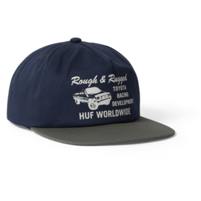 A navy blue baseball cap with a dark green brim and white embroidered text and truck image on the front.