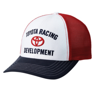 A white and red trucker hat with a black brim. The front panel of the hat is white with the text 'TOYOTA RACING DEVELOPMENT' embroidered in black, surrounding a red Toyota logo. The side and back panels are made of red mesh material