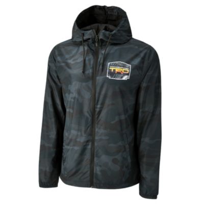 Black camouflage-patterned hooded jacket with a front zipper. The left chest area features a patch with ""TRD"" in bold letters and additional smaller text and graphics.