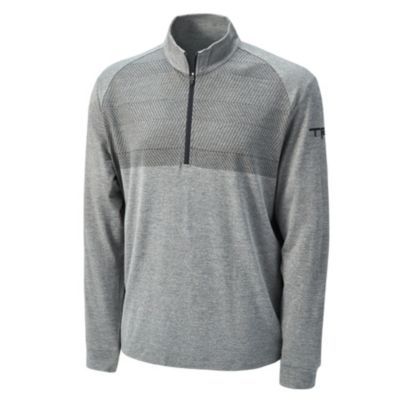 Gray long-sleeve quarter-zip pullover with a high collar and subtle textured pattern. Small TRD logo embroidered in black on the left sleeve near the shoulder.