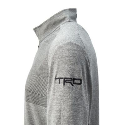 Side view of grey long-sleeve shirt with "TRD" embroidered on the upper arm