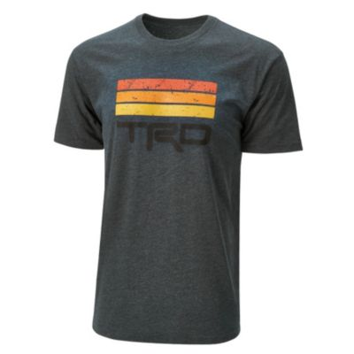 Dark gray T-shirt with three horizontal stripes in red, orange, and yellow on the front, and black 'TRD' text below the stripes