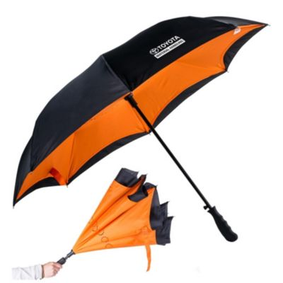 Orange inverted umbrella with push-button open and wind-resistant design.