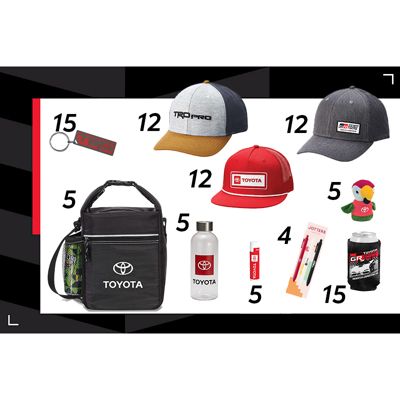 a collection of Toyota-branded merchandise, including a black keychain with the 'TRD' logo, three different styles of baseball caps ,a plush flower toy, black insulated lunch bag with Toyota logo, clear water bottle with Toyota logo,two pens in packaging.
