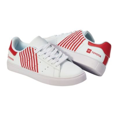 Two white sneakers with red accents. The sneakers have a white sole and laces, with red stripes on the sides. The heel area is red with the Toyota logo and text ""TOYOTA"" in white.