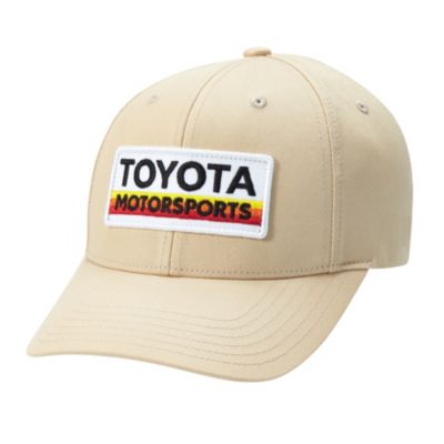 beige baseball cap with a white rectangular patch on the front.