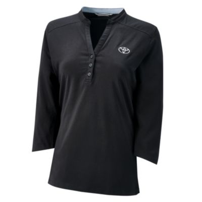 A black short-sleeve polo shirt with a collar and three buttons. The shirt features the Toyota logo embroidered on the left chest area.