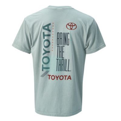 Back view of a T-shirt featuring the word 'TOYOTA' vertically on the left side, a central slogan 'BRING THE THRILL.' with a Toyota logo above it, and 'TOYOTA' printed again at the bottom.