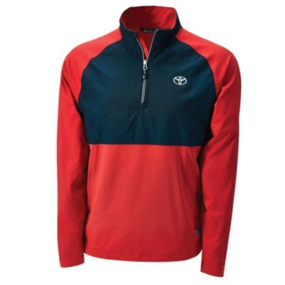 Long-sleeve half-zip pullover with a black upper section and red lower section and sleeves, featuring a white Toyota logo on the left chest.